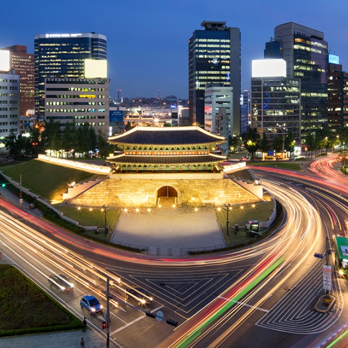 Busy city streets of Seoul, South Korea, at night.