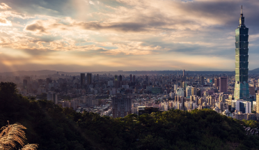 a view of the taipei cityscape at sunset