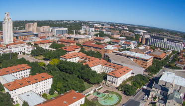 An aerial view of the UT tower and surrounding campus on a sunny day.
