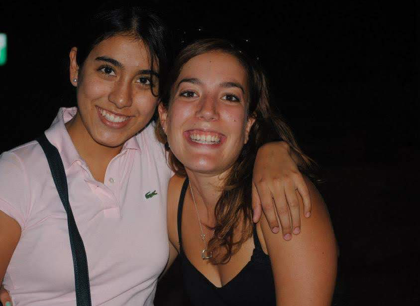 Alejandra with a female student smiling