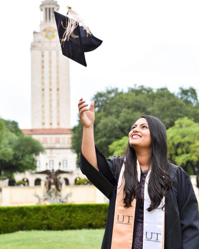 Diana throwing her cap in front of the UT tower
