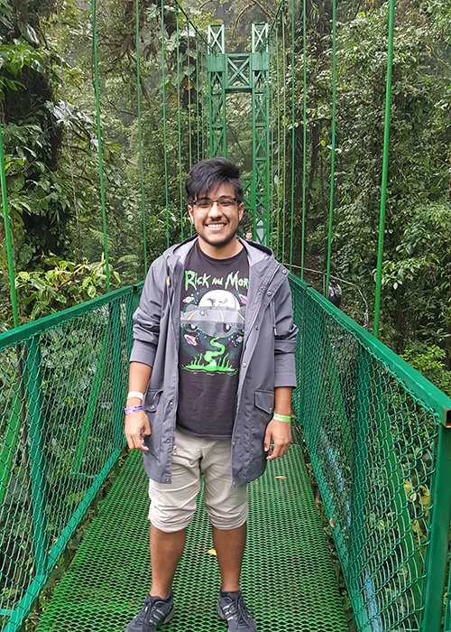 Feliciano Perez smiling on a bridge in Costa Rica