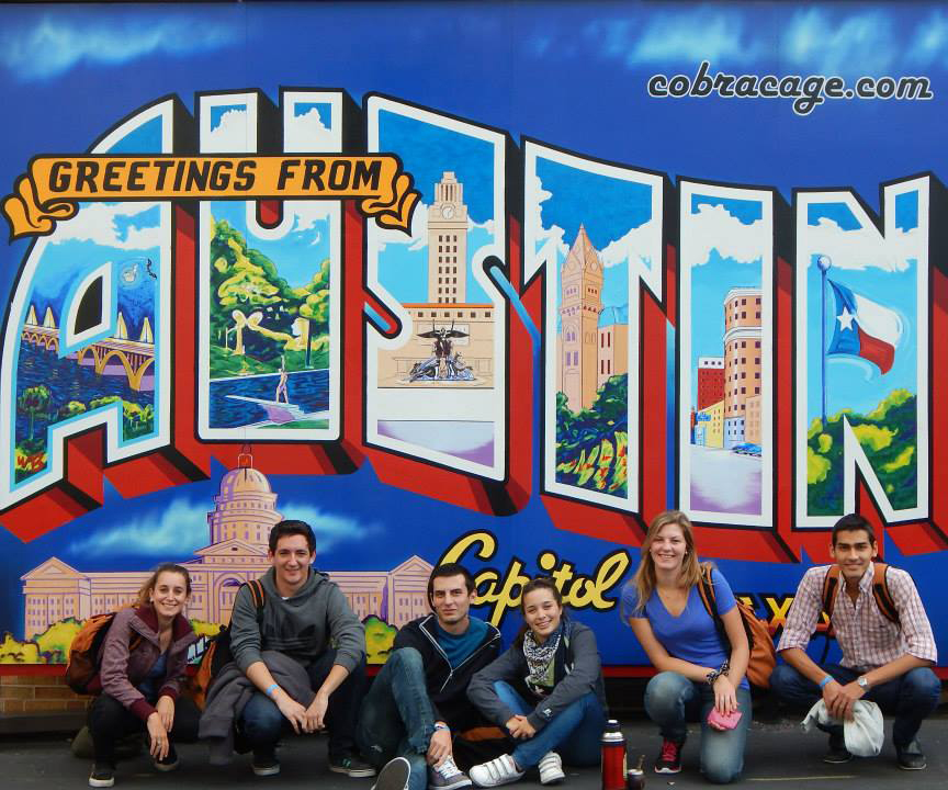 Gabriel Carlosena and his friends from the English Language Center program in front of the Austin mural
