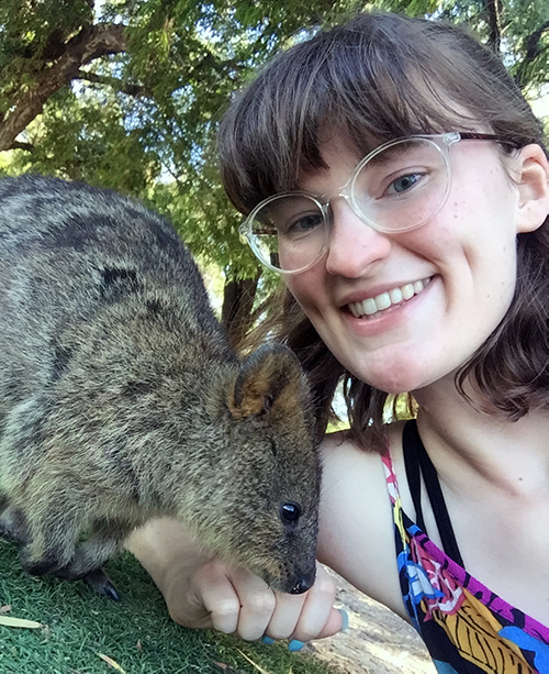 Ally poses with an australian animal at the wildlife center