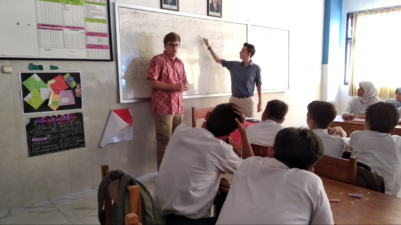 ​​Miguel teaching english to his students in the classroom