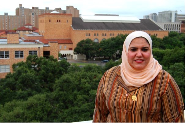 walaa stands in front of a view of the UT campus