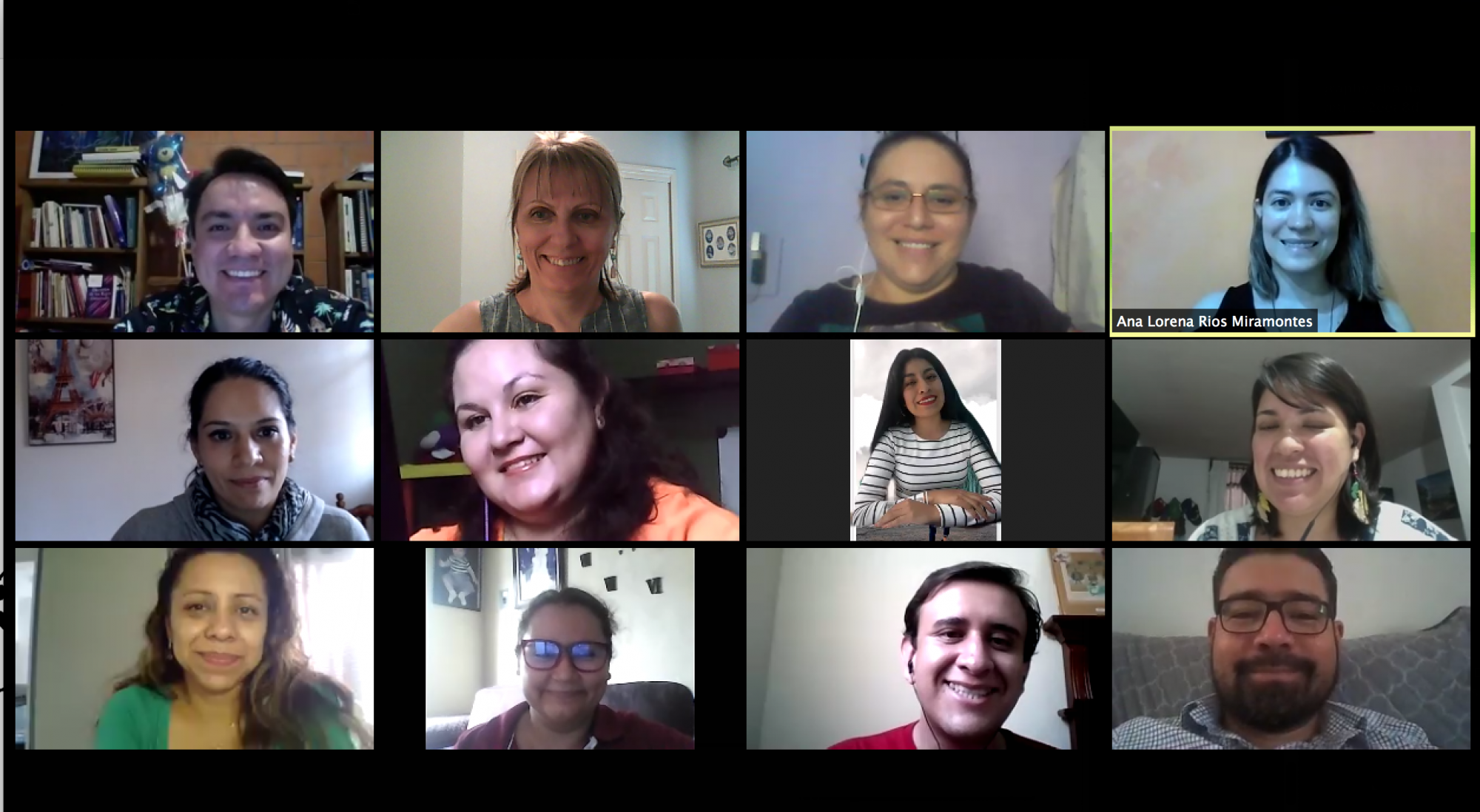 screenshot of several people in a grid on a video call smiling