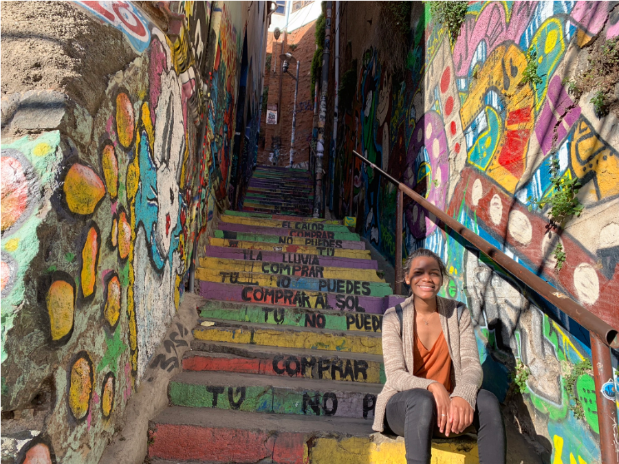 shania sits on a rainbow staircase in chile 