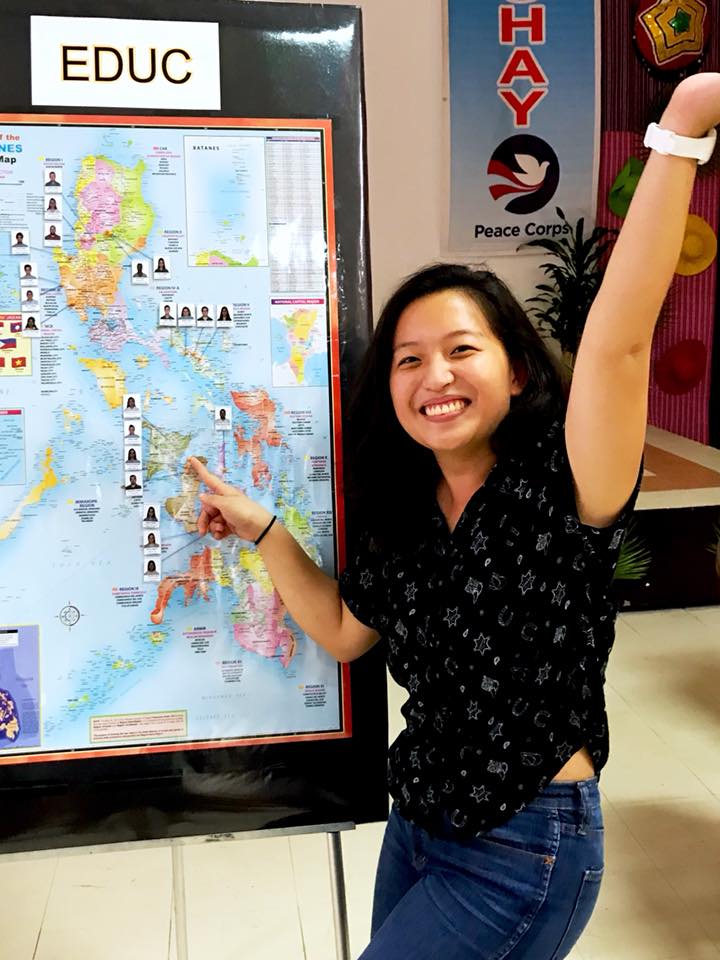 ​​​​​​​ Stephanie Estrera pointing to the Philippines on a map