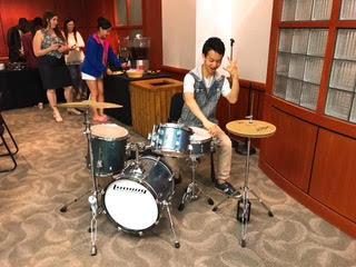 Rikuhiro plays the drums.