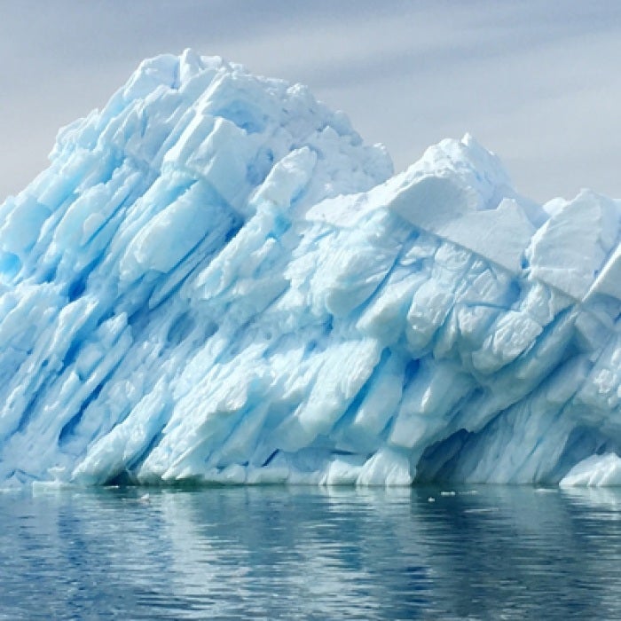 Antarctica ice berg surrounded by water