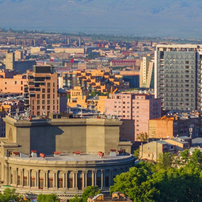 Armenian city with tall buildings and republic square in center