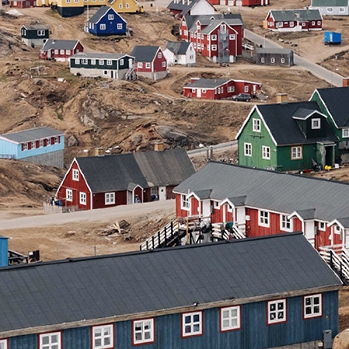 Colorful Greenland houses on hilly terrain