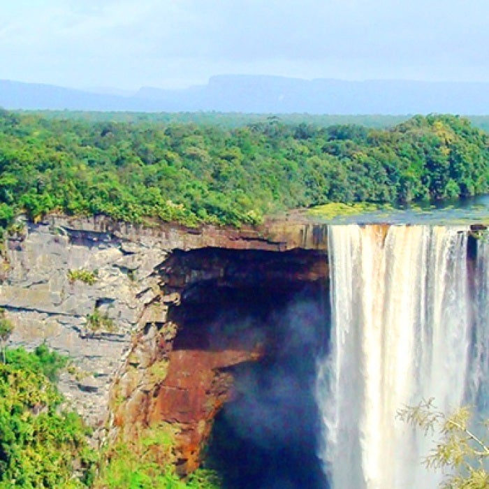 Waterfall in Guyana and thick green forest
