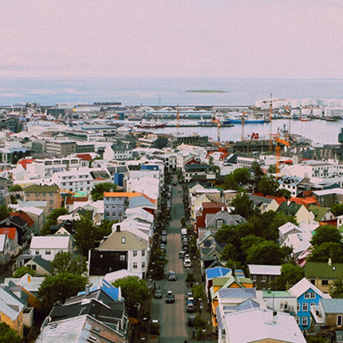 Icelandic city with colorful houses and purple sky