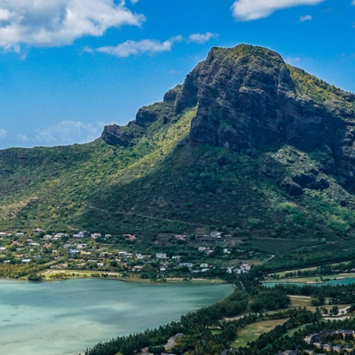 Green mountain on Mauritius island by the ocean