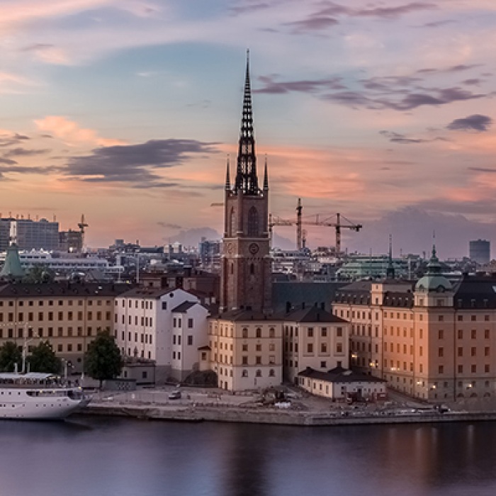 Swedish buildings with tower in center surrounded by water