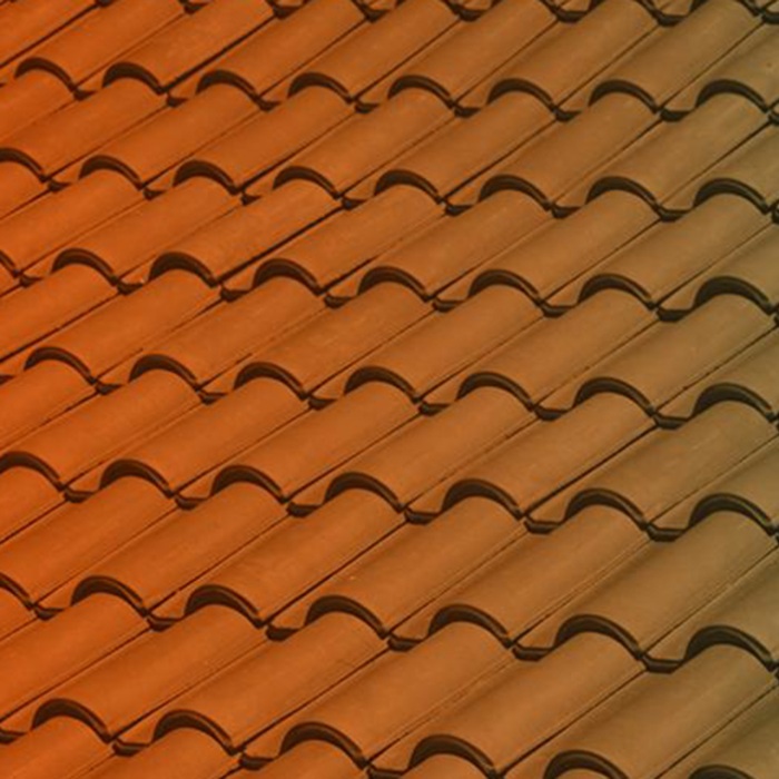 a close up of red rooftop tiles 