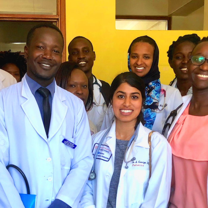 Smiling diverse group of doctors in white coats