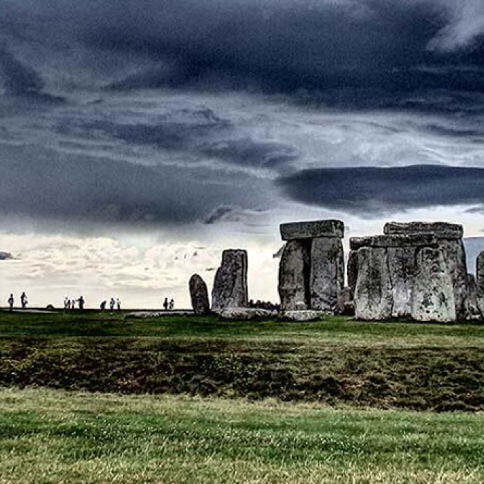 Storm clouds swirl over Stonehenge. 