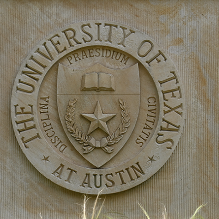 image of marble facade engraved with the University of Texas at Austin seal