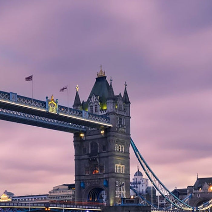 London bridge at sunset with purple cloudy sky