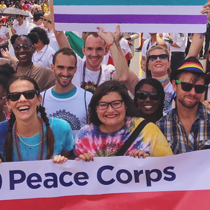 Peace Corps members celebrate pride with colorful banners