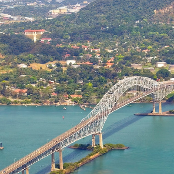 Aerial view of the Bridge of the Americas at the Pacific entrance to the Panama Canal with Panama City in the background