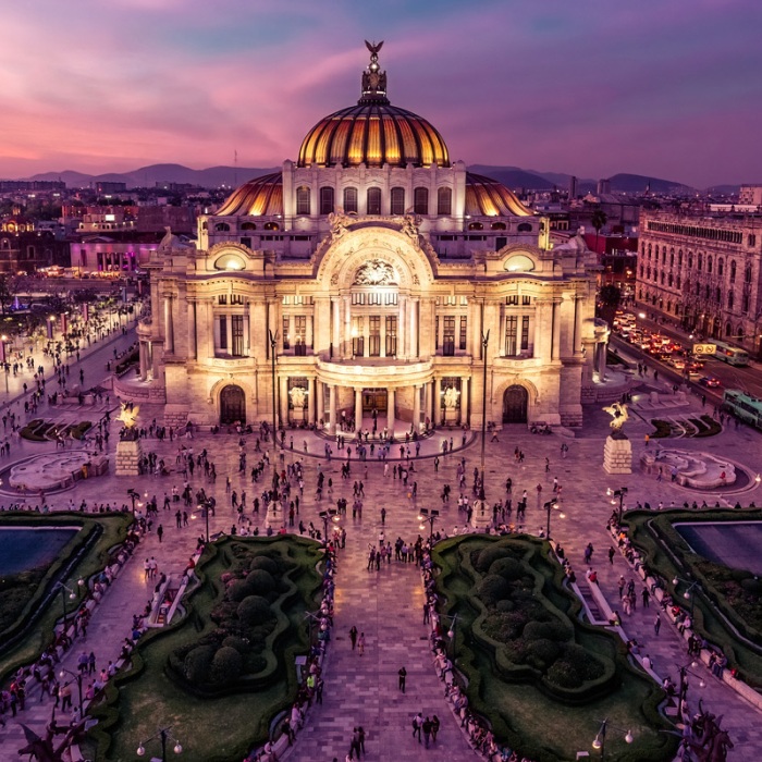 A aerial view of beautifully lit Mexico City in the evening