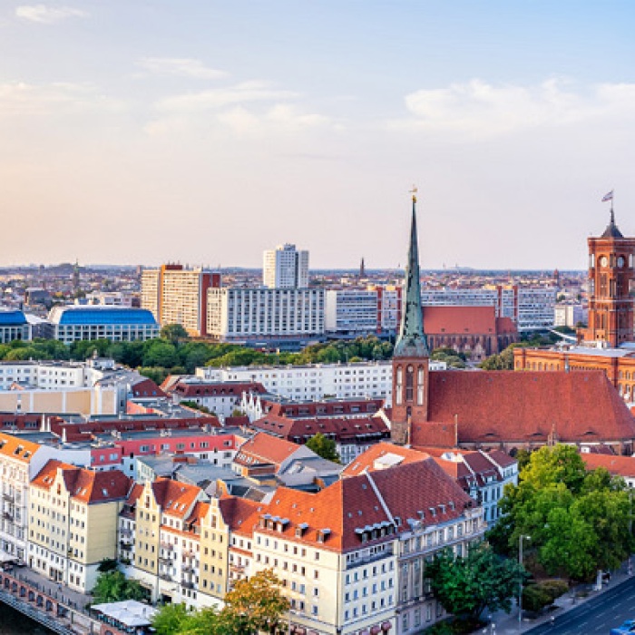 An aerial panoramic view of Berlin, Germany backdropped against a beautiful sky