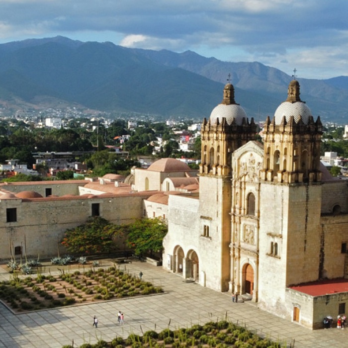 The main square and cathedral in Ciudad de Oaxaca, Mexico backdropped by high mountains