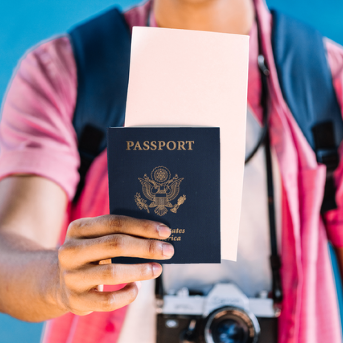 Individual holding up his passport