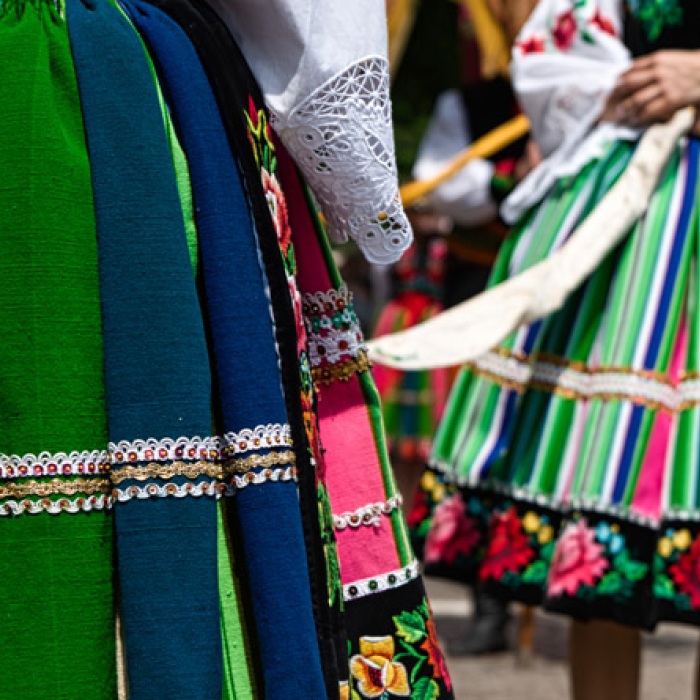 Close up of traditional colorful striped Polish Lowicz region folk skirts and embroidery