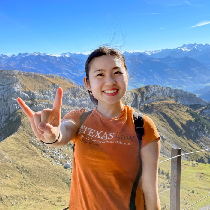 A UT student shows off their long horn pride while abroad