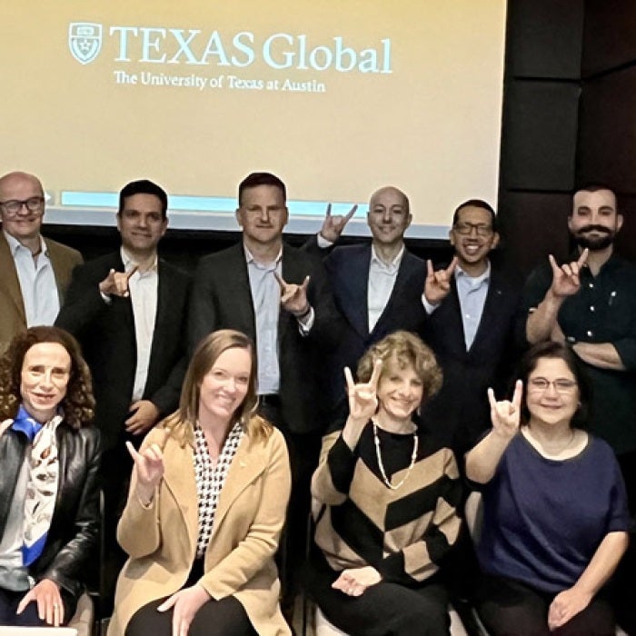 Monterrey Longhorns holding up the hook'em sign