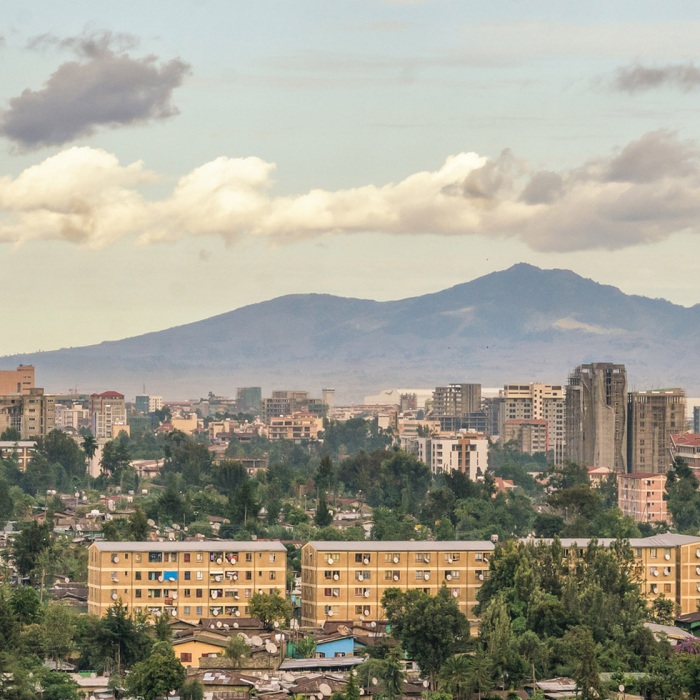 Aerial view of the Addis Ababa, the capital city of Ethiopia, backdropped by the distant mountain peaks