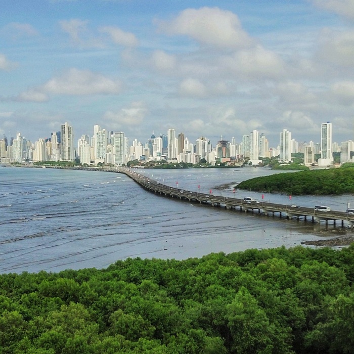 Picture of Panama City, Panama, that shows the skyline and the bay on a beautiful blue sky and puffy clouds day