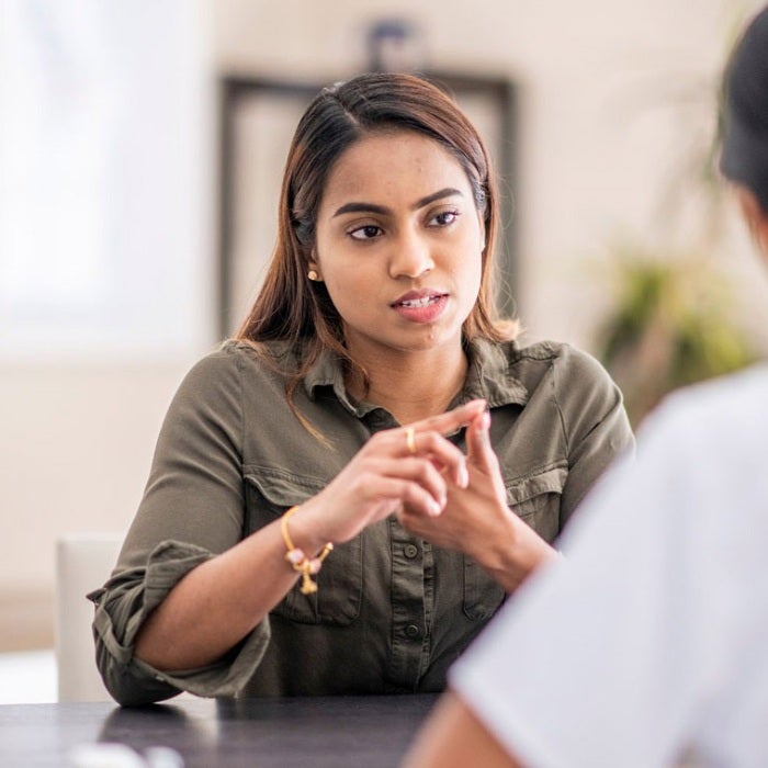 An advisor assists a student