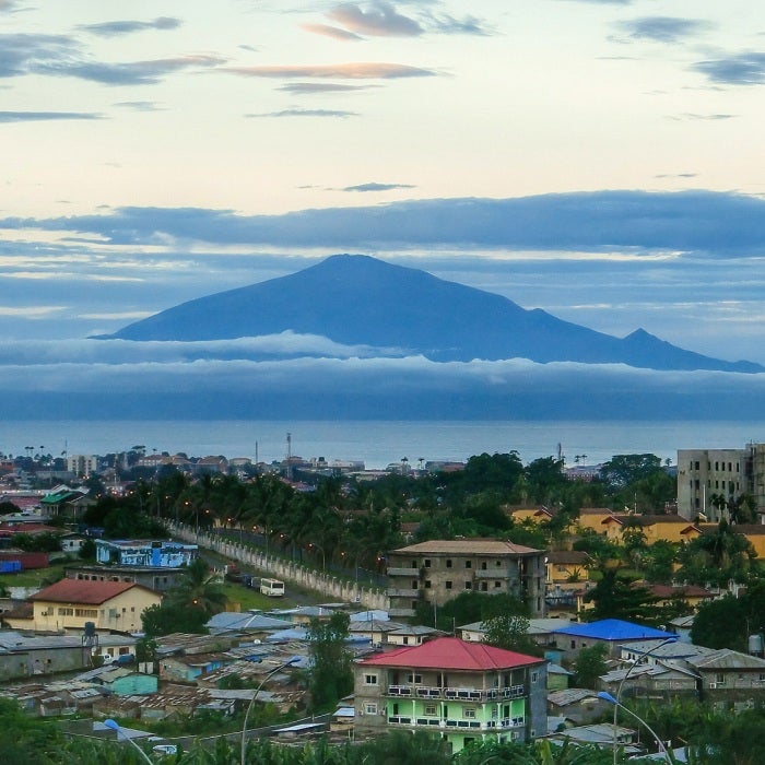 Mount Victoria, an active volcano in the country of Cameroon, as seen from across the coastal waters of the capital city of Malabo, Equatorial Guinea