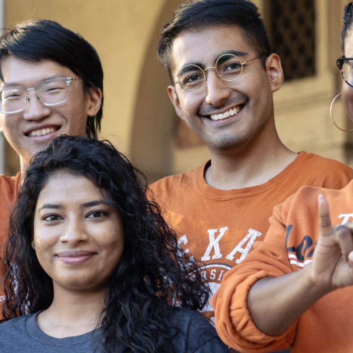 Smiling UT students show off their longhorn pride