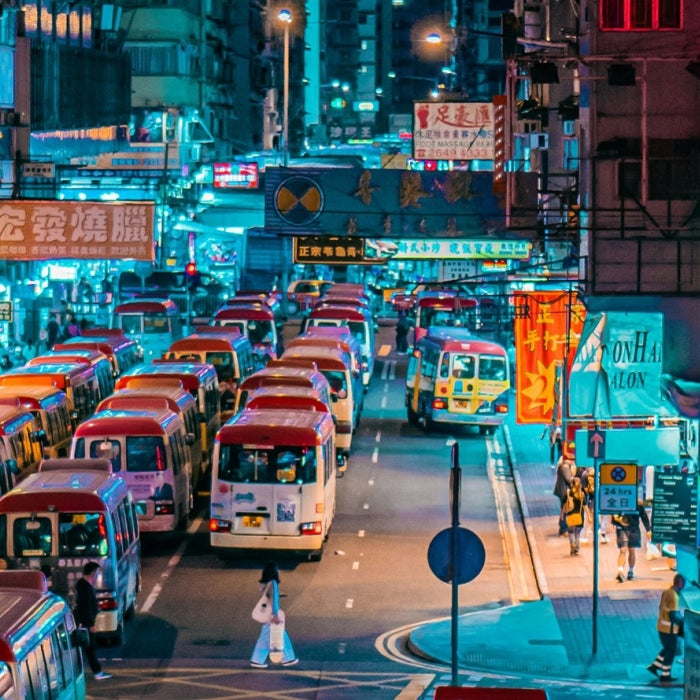 The busy Monk Kok shopping district in downtown Hong Kong is illuminated by neon signs at night