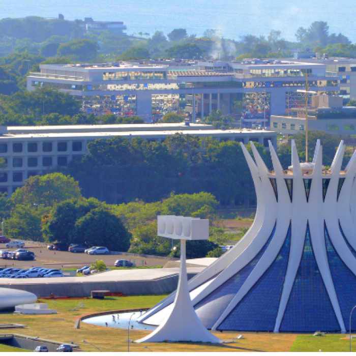A unique building structure in Brazil displays a cone-shaped white building with several windows
