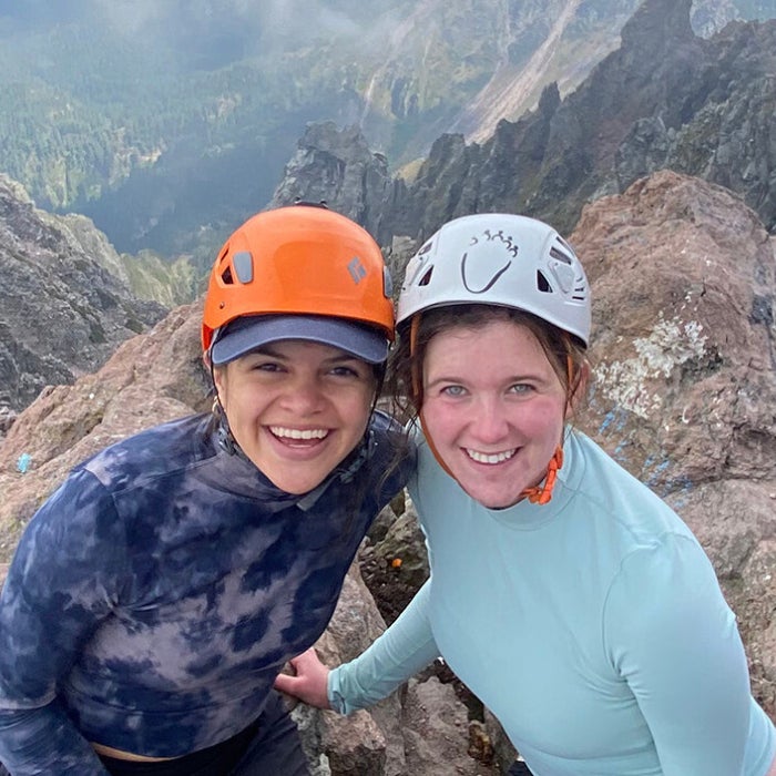 Members of UT Austin's Fulbright student program pose atop a mountain