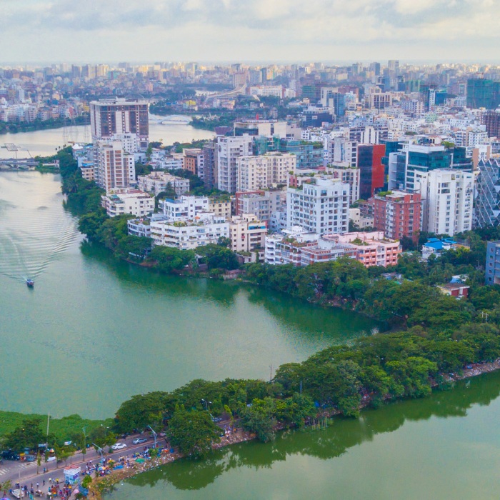 Aerial view of Dhaka, Bangladesh. Many buildings line the Hatirjheel lakefront. 