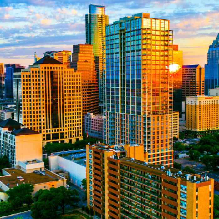 The city of austin shines as the sun comes up over downtown