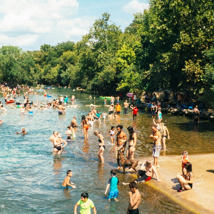 Locals the enjoy refreshing waters of Barton Springs pool on a hot summer day
