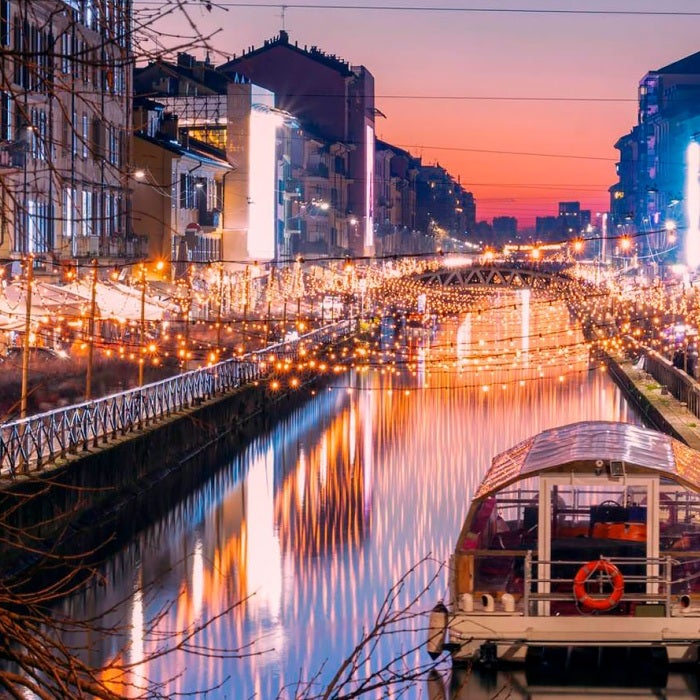 Naviglio Grande canal in Milan city, Italy, a popular tourist area, during a dramatic sunset