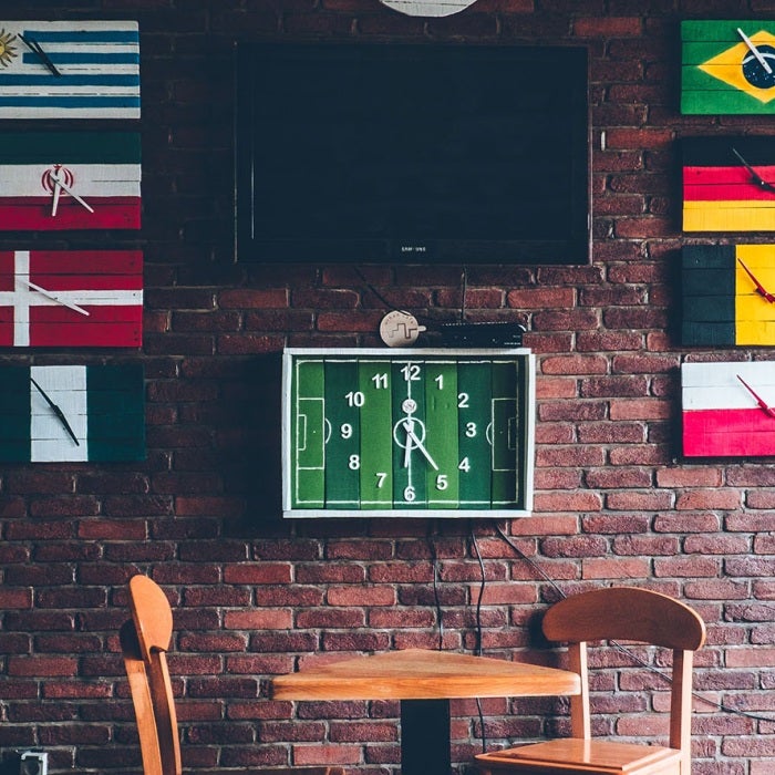 a globally oriented cafe with signs with flags of various countries from around the world