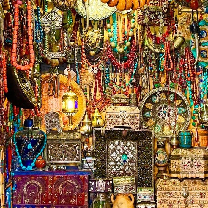 colorful beads adorning necklaces and plates in an exotic market 