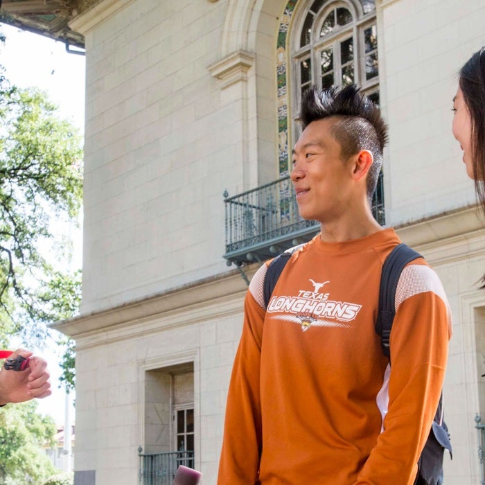 students interacting on campus outside